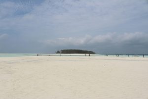 People on the beach at Mnemba Island, Tanzania, Tropical islands to visit in Africa instead of the Maldives