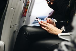 A woman chatting in a plane.