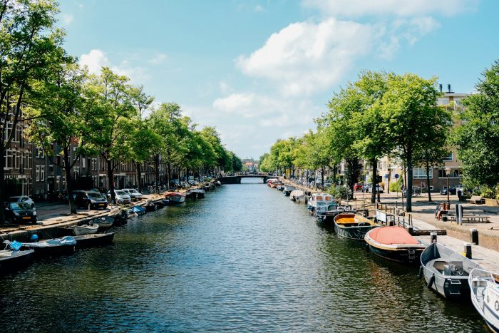 Boats on a canal in Amsterdam, the Netherlands. Places to visit in Europe.